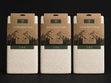 Lot de trois torchons en coton blanc sur fond noir
