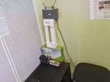 a desk with two chairs and a computer on top of it