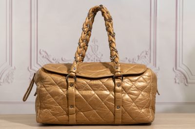 chanel gold quilted leather duffel bag with braid handles