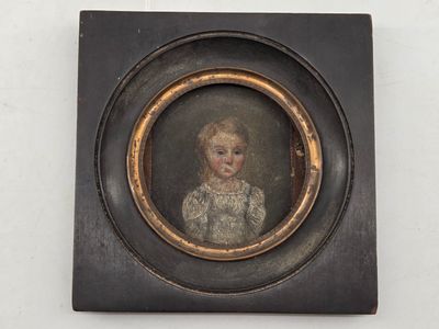 portrait of a young girl in a white dress in a black frame