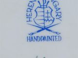 a close up of a plate with a blue and white design on it