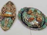 two decorative items that are sitting on a table