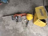 a hammer, a hammer, and a box on the floor