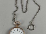 une montre de poche en argent et en or, munie d'une chaîne