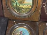 several framed pictures of flowers and trees are on display in a store
