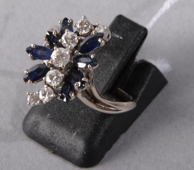 an image of a ring with blue and white stones