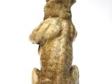 a statue of a bear that is sitting on its hind legs
