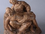 statue of a woman holding a child in her lap