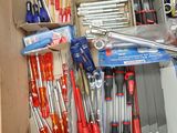 a box full of tools that are sitting on a shelf
