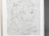 a drawing of a man ' s face is shown in a book