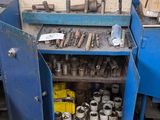 a blue cabinet with tools on it in a garage