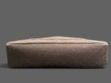 a small brown bag sitting on top of a gray surface