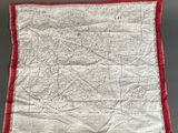 an old map is hanging on a wall in a room