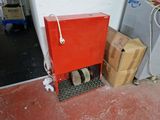 a red box that is sitting next to some boxes