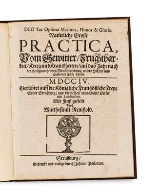 an old book with a picture of a globe on top of it