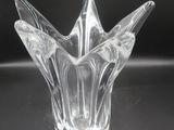 a glass vase that is sitting on a table
