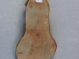 a picture of a piece of wood with a tag on it