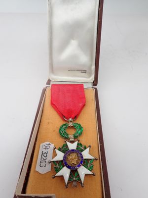 an image of a medal in a box with a ribbon