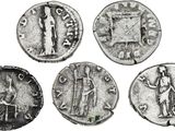 four ancient roman coins, one of which is a man and one of which is a woman