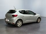a picture of a silver car parked in a showroom