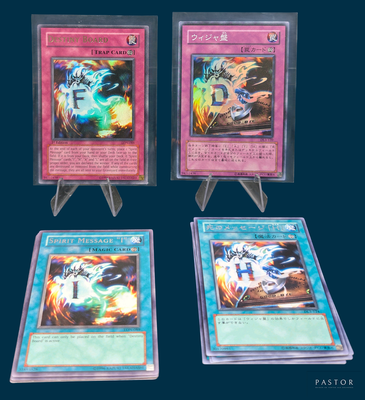 three cards are displayed in a display case on a blue background