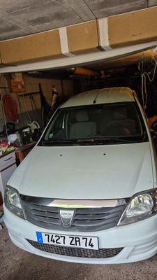 a small white car parked in a garage
