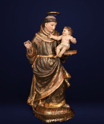 a statue of a woman holding a baby in her arms