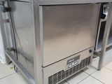 a stainless steel oven sitting on top of a counter