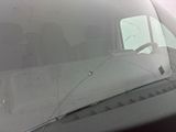 a broken windshield of a truck with a broken windshield