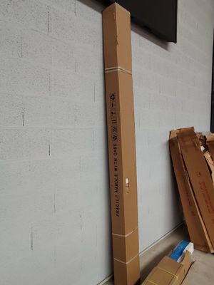 a pile of boxes sitting on the floor next to a wall