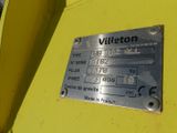 a metal plaque on the side of a yellow truck