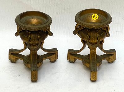 pair of antique brass candlesticks with lion heads on stands