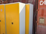 three yellow lockers sitting next to each other on the side of the road