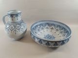 a blue and white bowl and a blue and white vase