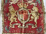 an image of a table cloth with a coat of arms and two lions on it