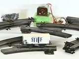 a lot of train tracks that have a box car on them