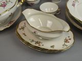 a lot of dishes that are sitting on a table