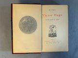 an open book with a picture of a man and a dog on it