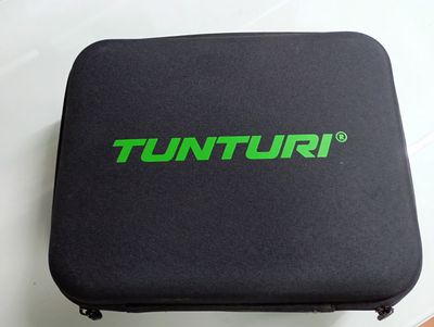 a close up of a black case with a green logo on it