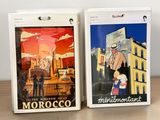 two boxes that have pictures on them on a table