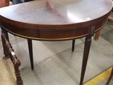 a table and chairs in a room with a lot of furniture
