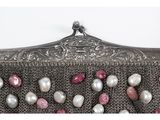 an image of a silver purse with pearls and pearls on it