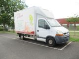 a white delivery truck parked in a parking lot
