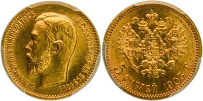 a gold sovereign coin with the head of a man in profile