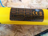 a close up of a yellow tube on a wooden surface