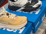 several pairs of tennis shoes are on display in a shoe store