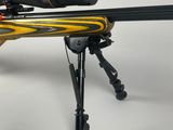 a close up of a rifle on a tripod on a white background