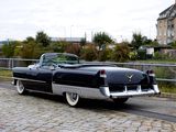 a black and silver car parked on the side of the road
