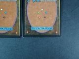 two cards that are sitting on a table