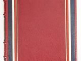 a red and blue book with a gold border on a white background